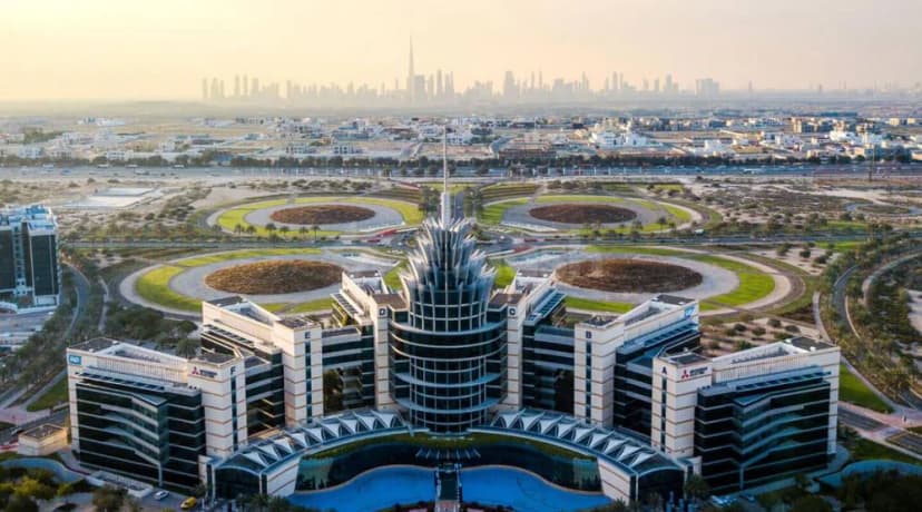 Facade of Dubai Silicon Oasis Authority in Dubai with central spire and circular landscaped grounds
