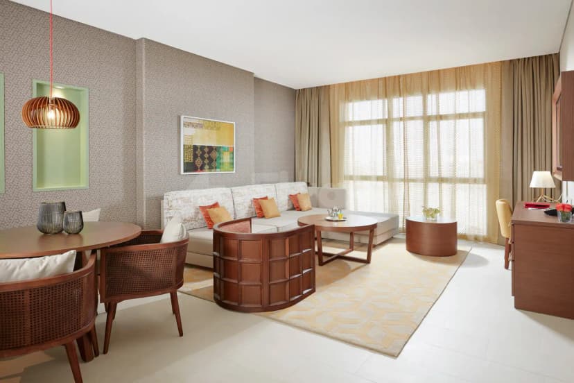 Meeting room at Shaza Riyadh in Riyadh with beige patterned wallpaper and a wooden partition screen