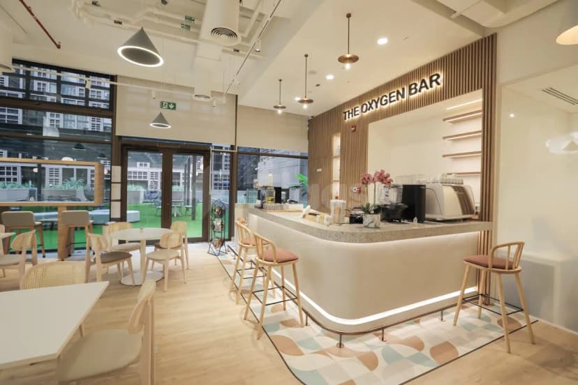 Oxygen bar at Cloud Spaces Mall World Trade Center Abu Dhabi with curved white counter and wooden slat