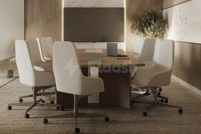 Boardroom at Tejwaans Business Centre in Doha featuring a wooden table, white fabric chairs with casters
