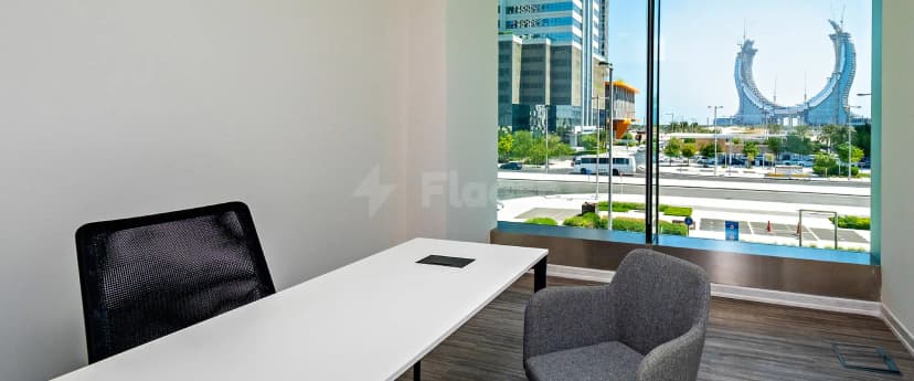 Meeting room at Nestwork Burj Alfardan Lusail in Lusail with large window overlooking city skyline