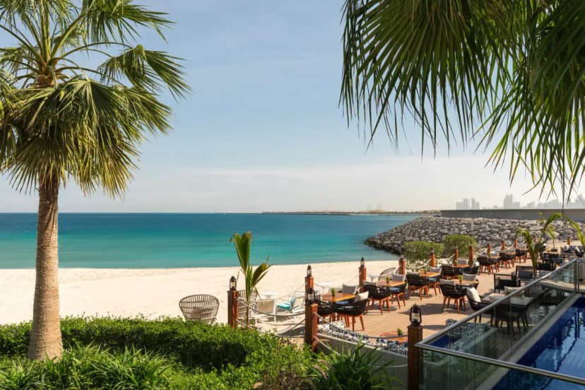 Isla Beach Bar terrace overlooking the beach and Arabian Gulf in Abu Dhabi.