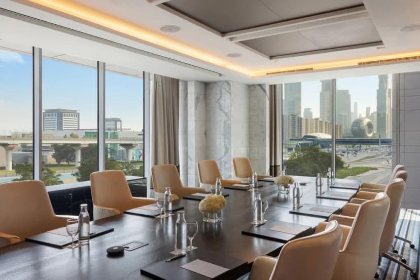 Meeting room at Sheraton Grand Hotel Dubai with views across the city skyline.