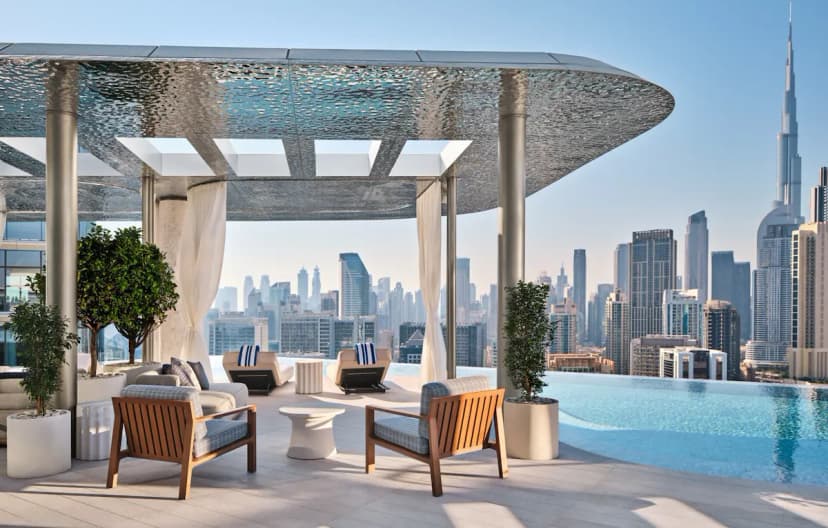 Rooftop pool cabana at The Lana overlooking the Dubai skyline and Burj Khalifa.