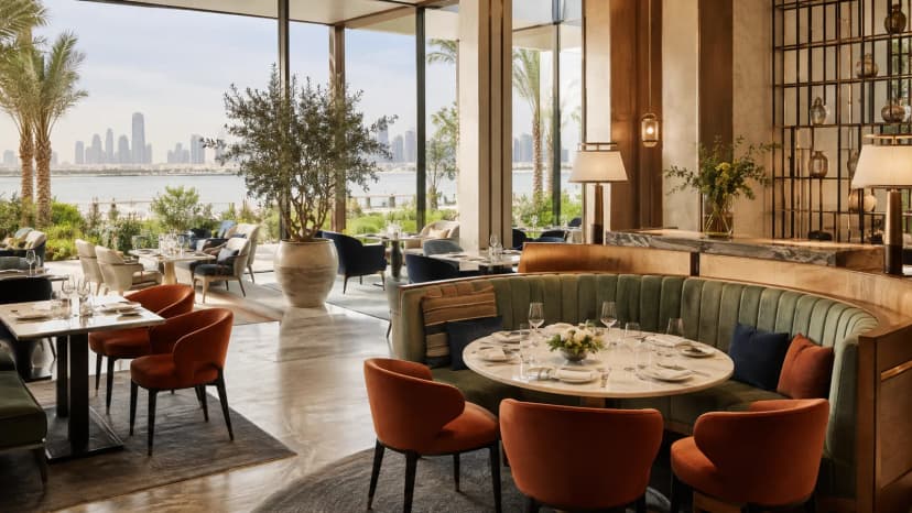 Colourful contemporary waterfront restaurant prepared for a corporate dinner in Doha.