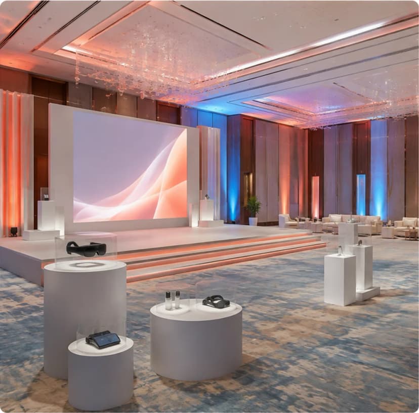 Contemporary presentation stage and product displays prepared for a corporate launch in Doha.