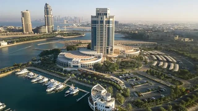 Aerial view of The Ritz-Carlton Doha and its West Bay Lagoon marina setting.
