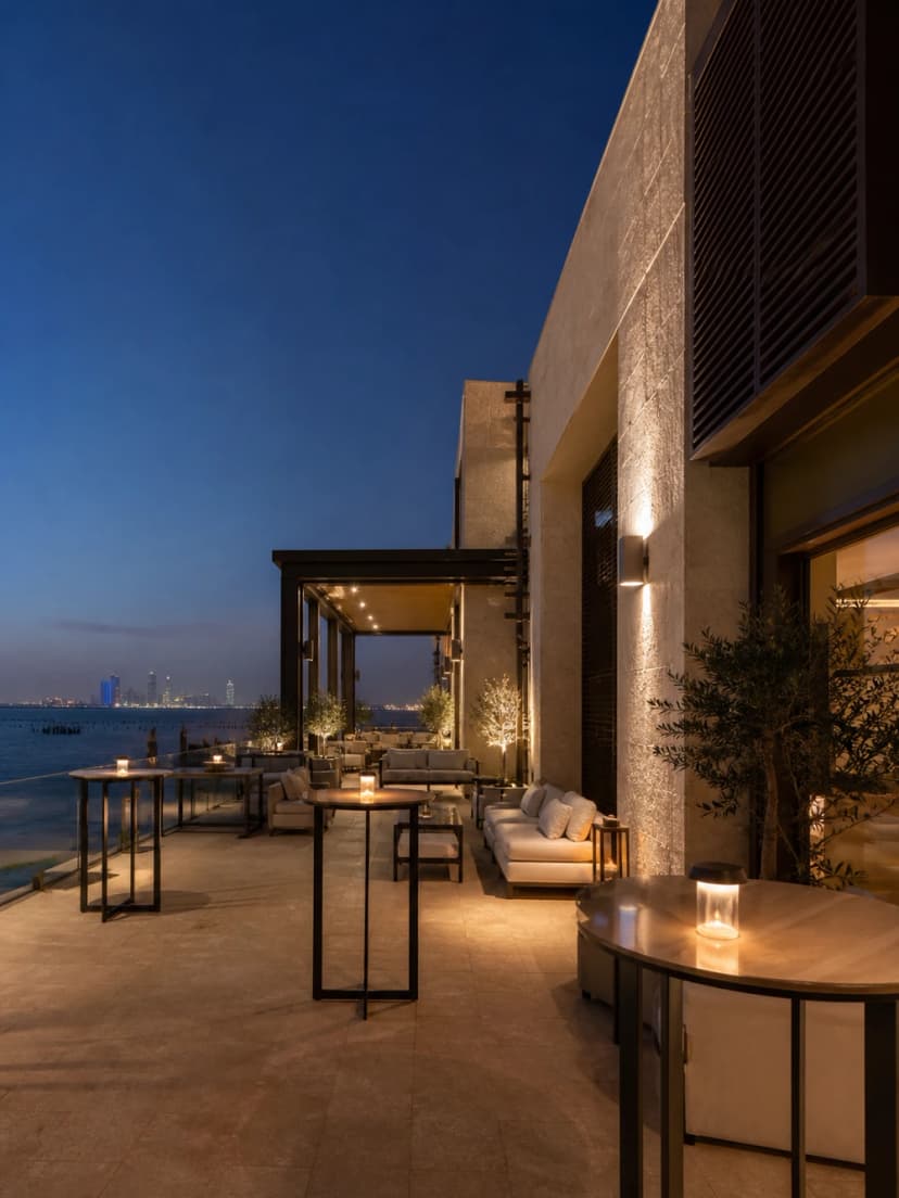 Waterfront terrace at dusk prepared for a professional networking reception.