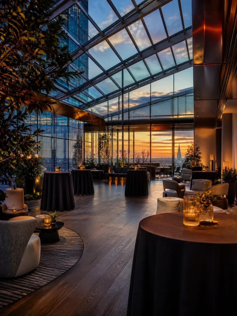 Glass-roofed London venue prepared for an evening corporate networking event.