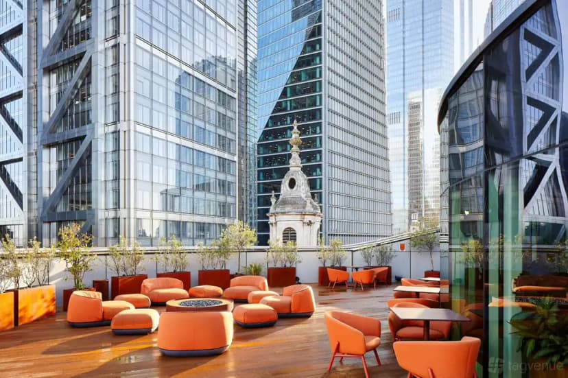 Orange lounge seating on the rooftop at Uncommon Liverpool Street in London.